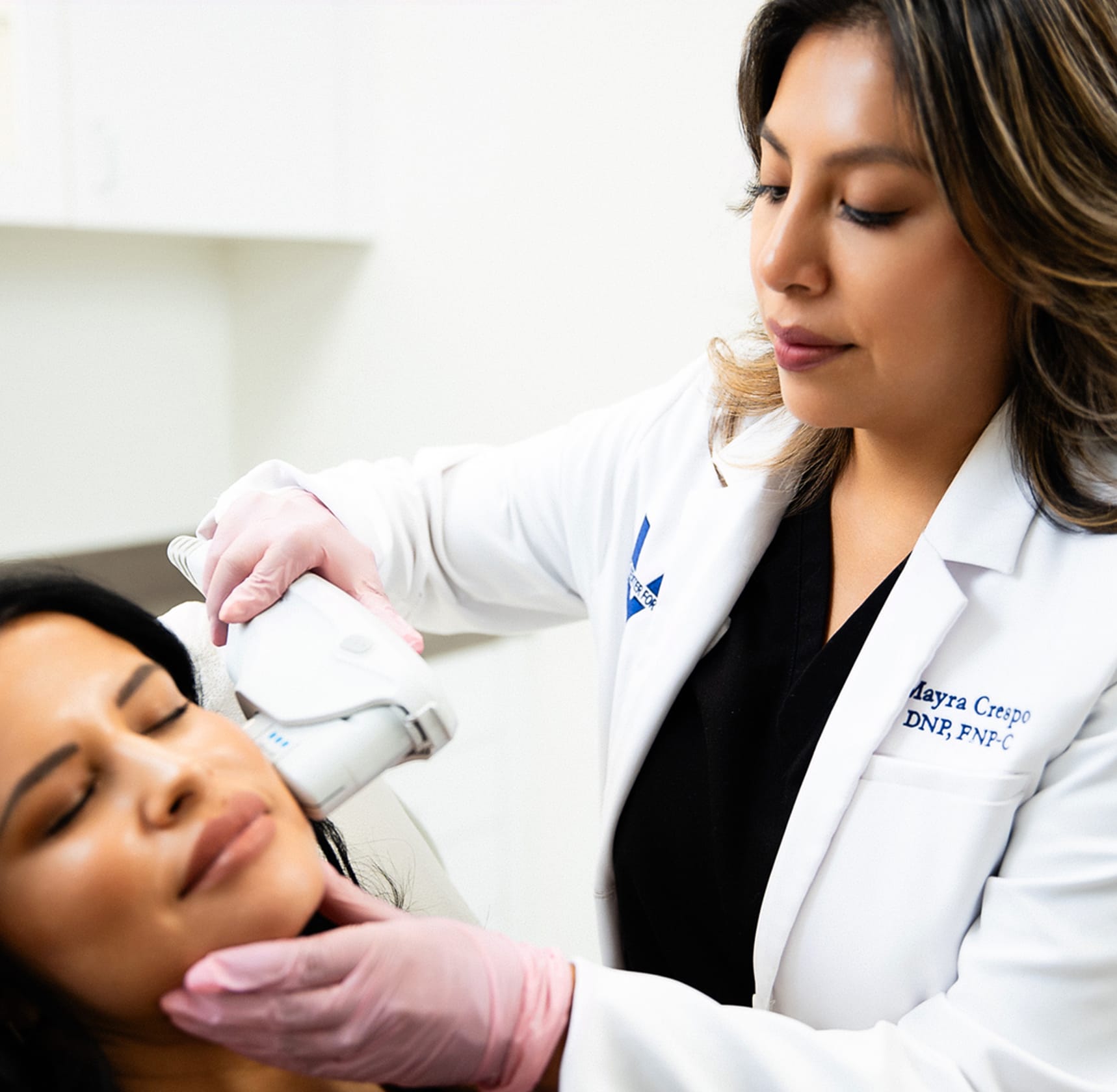 Nurse administering facial procedure